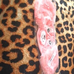 A Children's Apricot Colored Bear Face Mask